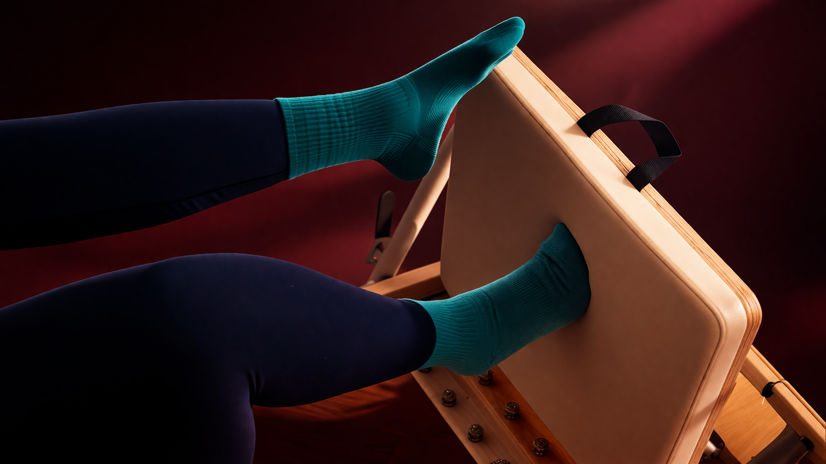 Female legs in a black leggings and teal socks
